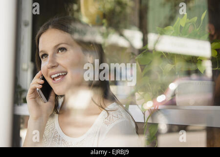 Caucasian woman talking on cell phone Stock Photo