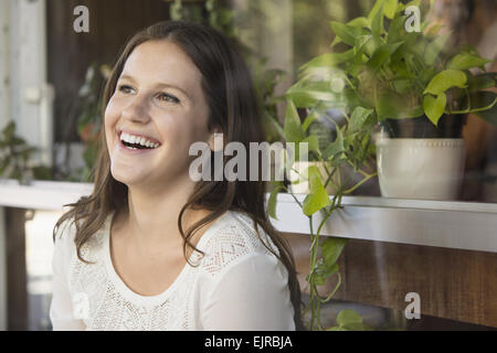 Caucasian woman laughing outdoors Stock Photo