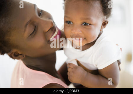 Close up of Black mother and son smiling Stock Photo