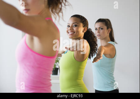 Women practicing yoga in class Stock Photo