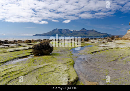 view of isle of rum from laig bay isle of eigg Stock Photo