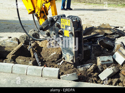 Excavator is working at the road construction Stock Photo