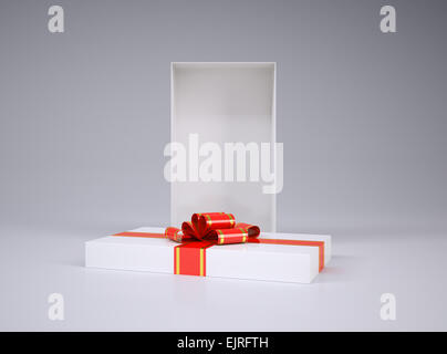 Open gift box and lid with ribbon Stock Photo