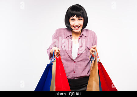 nice brunette with shopping bags in red shirt, on white Stock Photo