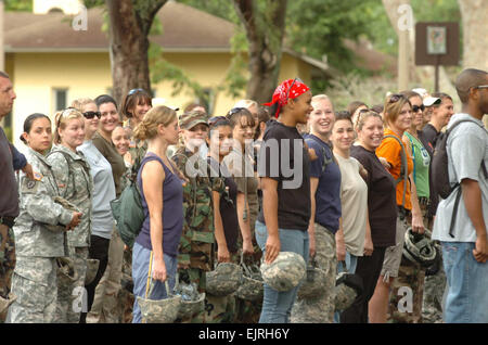 42 spouses of Soldiers assigned to 2nd Squadron, 6th Cavalry Regiment, 25th Combat Aviation Brigade, “fall-in” to formation moments before participating in a “Drill Down” elimination competition where spouses responded to basic facing movement commands much like a “Simon-Says” elimination event as part of  2-6 Cavalry’s Spouse Spur Ride at Wheeler Army Airfield, Nov. 15. Stock Photo