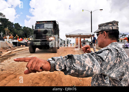 Members of 130th Engineer Battalion, 101st Troop Command, Puerto Rico National Guard, provide support to the people of Lares May 29, after heavy rains affected its municipal cemetery with mudslides.  Staff Sgt. Joseph Rivera Rebolledo Stock Photo