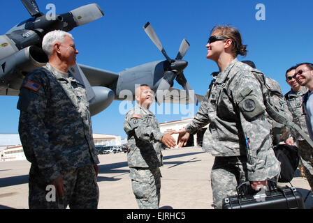 Brig. Gen. Manuel Ortiz left, U.S. Army South deputy commanding general, and Command Sgt. Maj. Gabriel Cervantes center, U.S. Army South command sergeant major, bid farewell to Capt. Kelly Pajak, an Army South engineer and planner, as she prepares to board an aircraft to Haiti March 9, 2010, in support of Operation Unified Response. Photo Credit: Robert R. Ramon, U.S. Army South Public Affairs.  U.S. Army South to assume responsibility as JTF-Haiti Headquarters  /-news/2010/03/16/35914-us-army-south-to-assume-responsibility-as-jtf-haiti-headquarters/ Stock Photo