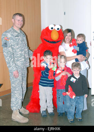 Spencer Family  Elizabeth M. Lorge April 30, 2008 visit: /-news/2008/04/30/8882-sesame-street-releases...  /-news/2008/04/30/8882-sesame-street-releases-new-dvd-for-military-children/    Maj. Greg Spencer, Elmo, his sons Sam, 6, Ethan, 5, his wife Heather, Gabe, 3, and Joel, 9 months, pose April 29 before the launch of the new Sesame Workshop DVDs for military children, &quot;Talk, Listen, Connect: Deployments, Homecomings, Changes.&quot; Stock Photo