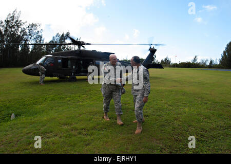 U.S. Army Maj. Gen. Anthony Crutchfield greets Army Chief of Staff Gen. Ray Odierno as he exit a UH-60 Black Hawk Helicopter at Camp Smith, HI, Jan. 9, 2013.  U.S. Army  Staff Sgt. Teddy Wade Stock Photo