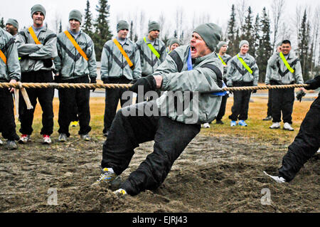 U.S. Army 1st Lt. Kenneth Cummings, with Headquarters Company, 4th Brigade Combat Team Airborne, 25th Infantry Division, shows his war face during the tug-of-war event in the Spartan Competition Derby PT here May 17, 2013. The tug-of-war event was one of seven total events Spartan paratroopers participated in the first Spartan Competition Derby.  U.S. Army Sgt. Eric-James Estrada Stock Photo