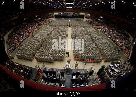 32nd Brigade Command Sgt. Maj. Ed Hansen, on floor in front of podium, accepts reports from battalion command sergeants major as the brigade forms at the start of the Feb. 17 send-off ceremony at the Dane County Veterans Memorial Coliseum, Madison, Wis.  Family members and public officials bade farewell to some 3,200 members of the 32nd Infantry Brigade Combat Team and augmenting units, Wisconsin Army National Guard, in the ceremony.  The unit is bound for pre-deployment training at Fort Bliss, Texas, followed by a deployment of approximately 10 months for Operation Iraqi Freedom. Wisconsin De Stock Photo