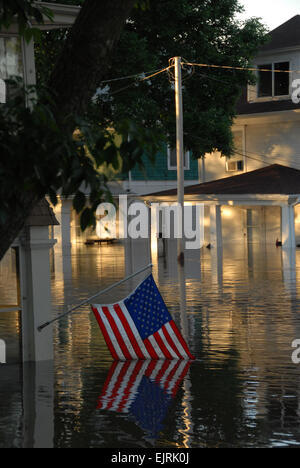 The submerged American flag shows the devastation of the flood in downtown Cedar Rapids, Iowa, June 13, 2008. Iowa National Guard Soldiers and Airmen are working with state and local agencies to provide security and help with flood relief operations.  Staff Sgt. Oscar M. Sanchez-Alvarez Stock Photo