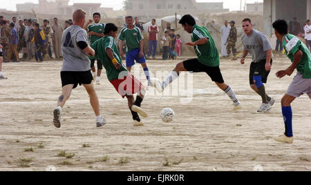 Task Force Summit Soldiers Battle Iraqis on Soccer Field  Staff Sgt. Margaret C. Nelson June 16, 2008  Soldiers of 1st Battalion, 87th Infantry Regiment, 1st Brigade, 10th Mountain Division compete against a soccer team comprised of Sons of Iraq members in Riyadh, Iraq, June 11. The Soldiers lost to the Iraqis, 4-1, in the second of a five-game series which will match the Soldiers against teams around the Hawijah District located in the Kirkuk Province of northeastern, Iraq. The Soldiers lost the previous week to a team from Mahus, 6-1. Stock Photo