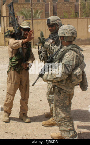 U.S. Army Soldiers high five between iterations during fast rope ...