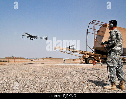 Spc. Raymond Poltera, Tactical Unmanned Aerial Vehicle operator, 1st Brigade Combat Team, 4th Infantry Division, Multi-National Division-Baghdad, launches an RQ-7B Shadow 200 TUAV from a pneumatic launcher at the aircraft's primary launch and recovery site on Camp Taji Aug. 11, 2008. The Shadow provides commanders on the ground all throughout the MND-B area of operations the ability to quite literally see the entire battlefield. As the leading provider and provisional authority for the MND-B's airspace, the Fort Hood, Texas, based Combat Aviation Brigade, 4th Inf. Div., provides and maintains  Stock Photo