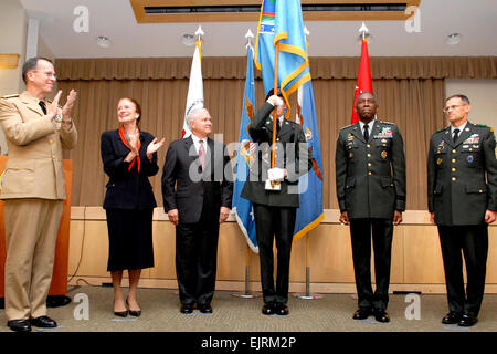 L to r Chairman of the Joint Chiefs of Staff Admiral Mike Mullen, Administrator, United States Agency for international Developement and Director of Foriegn Assistance, Department of State Henrietta H. Fore, Secretary of Defense Robert M. Gates, flag bearer, Commander, U.S. Africa Command General William E. Ward, Command Sergeant Major United States Africa Command Sergeant Major Mark S. Ripka all stand proudly after the unfolding of the flag during the U.S. Africa Command Unified Command Activation ceremony in the Pentagon Conference Center Oct. 1, 2008. Stock Photo