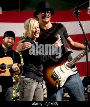 Grammy award winning musician Kid Rock, American Idol contestant and country musician Kellie Pickler and musician Zack Brown entertain troops stationed at Kandahar, Afghanistan during the 2008 USO Holiday Tour. Tour host U.S. Navy Adm. Mike Mullen, chairman of the Joint Chiefs of Staff, along with his wife Deborah, welcomed comedians John Bowman, Kathleen Madigan and Lewis Black; actress Tichina Arnold on the tour bringing music and entertainment to service members and their families stationed overseas.  Mass Communication Specialist 1st Class Chad J. McNeeley Stock Photo