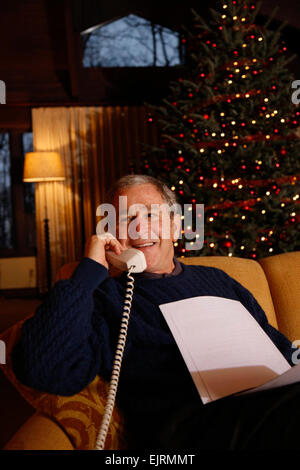 President George W. Bush makes his annual Christmas Eve telephone call to U.S. Armed Forces Wednesday, Dec. 24, 2008, from Camp David.  White House photo by Eric Draper Stock Photo