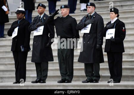 Armed Forces Inaugural Committee AFIC members standing-in as the newly-elected officials pay respects as the U.S. Joint Color Guard passes in review on the U.S. Capitol east front in Washington, D.C., on Jan. 11. 2009.  More than 5,000 men and women in uniform are providing military ceremonial support to the presidential inauguration, a tradition dating back to George Washington's 1789 inauguration.   Tech. Sgt. Suzanne M. Day, U.S. Air Force   Servicemembers rehearse for upcoming presidential inauguration  /-news/2009/01/12/15686-servicemembers-rehearse-for-upcoming-presidential-inauguration/