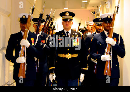 Members of the joint honor cordon carry weapons at port arms as they get ready at the U.S. Capitol for the 56th Presidential Inauguration to begin in Washington, D.C., Jan. 20, 2009. More than 5,000 men and women in uniform are providing military ceremonial support to the presidential inauguration, a tradition dating back to George Washington's 1789 inauguration.   Tech. Sgt. Suzanne M. Day,