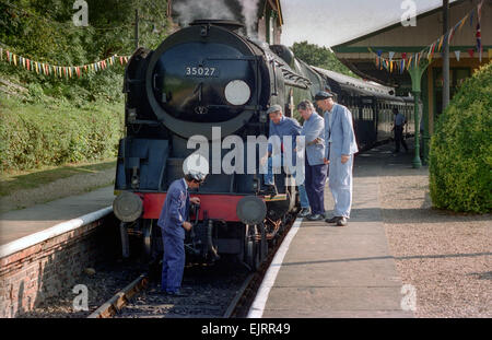 Steam train driving instructor Clive Groom (moustache) with trainees Charlie Johnston (cloth cap) and Bob Baines (black cap). Stock Photo