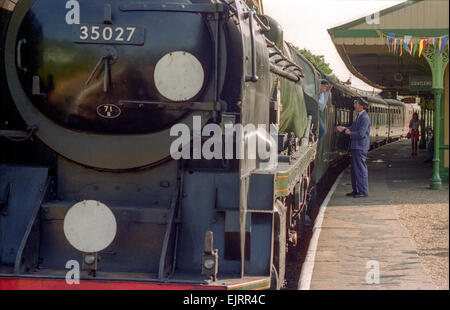 Steam train driving instructor Clive Groom (moustache) with trainees Charlie Johnston (cloth cap) and Bob Baines (black cap). Stock Photo