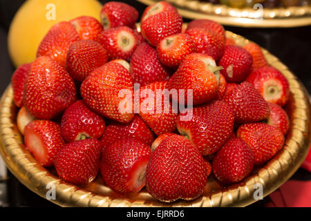 High view of lots of fresh juicy strawberries in a tub Stock Photo