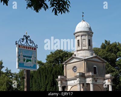 The Village Sign alongside one of The Mistley Towers, Mistley Essex, England Stock Photo