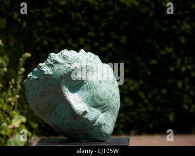 Sculpture of a angled Face with Eyes Close on a plinth Stock Photo