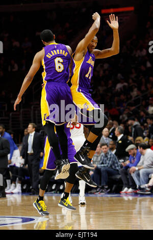 Overtime. 30th Mar, 2015. Los Angeles Lakers forward Wesley Johnson (11) jumps in the air to celebrate with guard Jordan Clarkson (6) during the NBA game between the Los Angeles Lakers and the Philadelphia 76ers at the Wells Fargo Center in Philadelphia, Pennsylvania. The Los Angeles Lakers won 113-111 in overtime. © csm/Alamy Live News