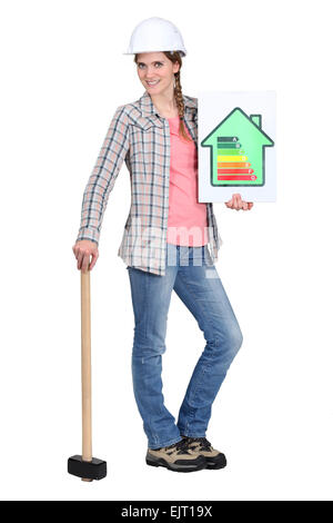 Builder with energy rating sign Stock Photo