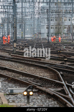Railway workers on the railway track field of Zurich main station, one of Europe's busiest railway stations. Stock Photo