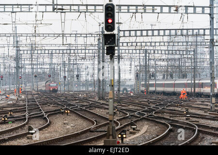 Railway workers and trains on the railway track field of Zurich main station, one of Europe's busiest railway stations. Stock Photo