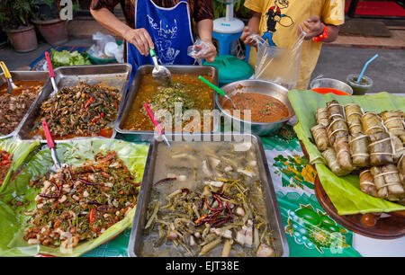 Chiang Mai night market, Thailand. Late evening just before nightfall. Local foods on offer. Stock Photo
