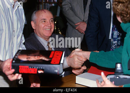 Former Soviet President Mikhail Gorbachev, with his distinctive port-wine stain on his head, smiles as he signs copies of his new autobiography 'Memoirs' at Borders Books & Music, October 25, 1996 in Washington, D.C. Stock Photo