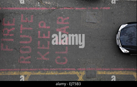 A car approaches a keep clear sign Stock Photo