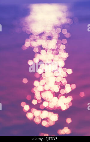 Blurred reflection in water, bokeh light abstract background. Stock Photo