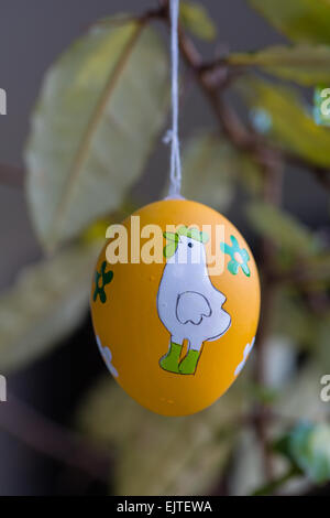 Easter eggs hanging on branches Stock Photo