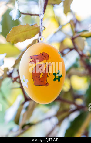 Easter eggs hanging on branches Stock Photo