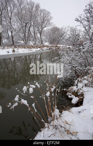 The East Holland River at Fairy Lake Park after an early winter snowfall. Newmarket, Ontario, Canada. Stock Photo