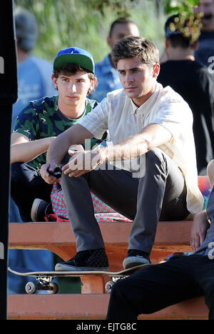 Actor Zac Efron filming a scene for his new movie 'We Are Your Friends'. In the scene he is seen smoking a fake marijuana joint and acting out a drug deal in a park in Encino. Featuring: Zac Efron,Alex Shaffer Where: Encino, California, United States When Stock Photo