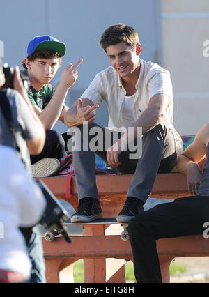 Actor Zac Efron filming a scene for his new movie 'We Are Your Friends'. In the scene he is seen smoking a fake marijuana joint and acting out a drug deal in a park in Encino. Featuring: Zac Efron,Alex Shaffer Where: Encino, California, United States When Stock Photo