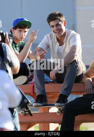 Actor Zac Efron filming a scene for his new movie 'We Are Your Friends'. In the scene he is seen smoking a fake marijuana joint and acting out a drug deal in a park in Encino. Featuring: Zac Efron,Alex Shaffer Where: Encino, California, United States When Stock Photo