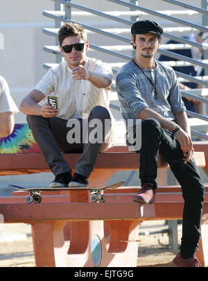 Actor Zac Efron filming a scene for his new movie 'We Are Your Friends'. In the scene he is seen smoking a fake marijuana joint and acting out a drug deal in a park in Encino. Featuring: Zac Efron,Shiloh Fernandez Where: Encino, California, United States Stock Photo