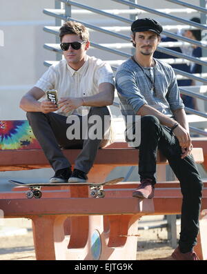 Actor Zac Efron filming a scene for his new movie 'We Are Your Friends'. In the scene he is seen smoking a fake marijuana joint and acting out a drug deal in a park in Encino. Featuring: Zac Efron,Shiloh Fernandez Where: Encino, California, United States Stock Photo