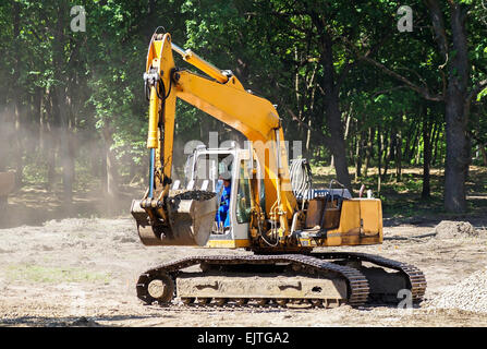 Excavator at the road construction Stock Photo