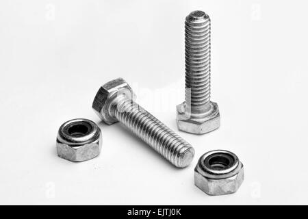 two new locking nuts and bolts isolated on a white background Stock Photo