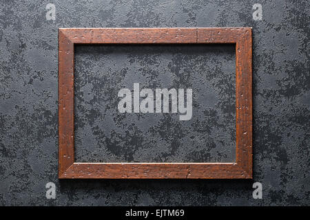 old wooden frame on black textured background Stock Photo