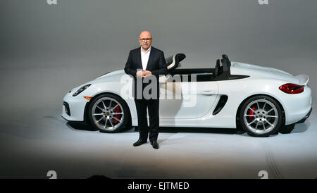 New York, USA. 31st Mar, 2015. Porsche CEO Matthias Mueller stands in front of a model of the Boxster Spyder at the world premiere of the new car in New York, USA, 31 March 2015. The Spyder is a light version of the Boxster version presented in 1996 and weighs 1,315kg, which allows it to accelerate from 0 to 100 km/hour in just over four seconds. Photo: CHRIS MELZER/dpa - NO WIRE SERVICE -/dpa/Alamy Live News Stock Photo
