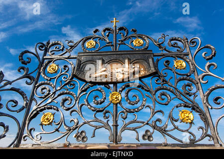 The iron grille with a relief, where according to legend was thrown into the river St John of Nepomuk, Charles Bridge, Prague Czech Republic Europe Stock Photo